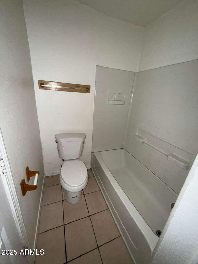 712 East 17th Street, Unit B Douglas, AZ 85607 - Photo 16 of 20 a bathroom with a toilet and a shower