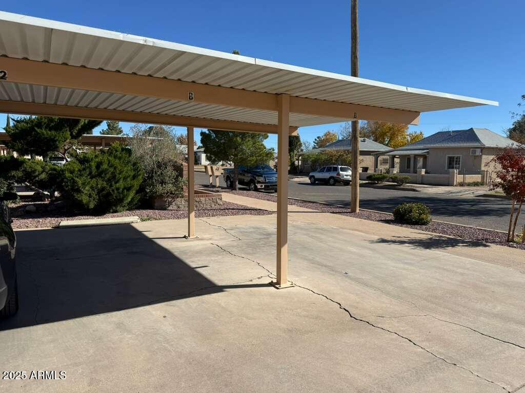 712 East 17th Street, Unit B Douglas, AZ 85607 - Photo 19 of 20 a patio with a table and chairs under an umbrella
