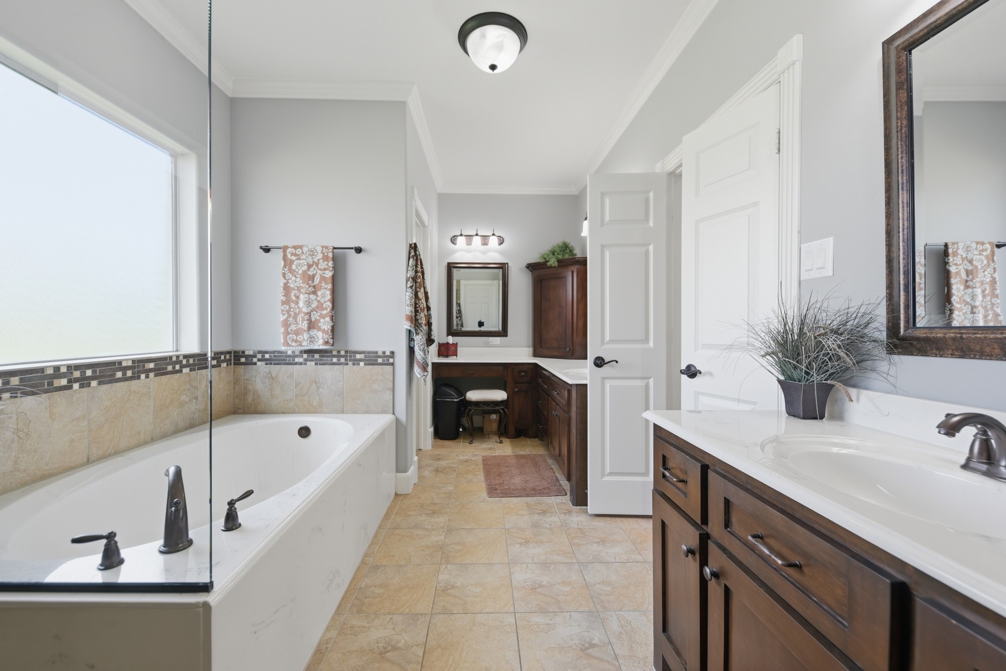 1205 Pecan Glen Road Brenham, TX 77833 - Photo 29 of 40 Primary Bathroom with soaking tub, dual vanities