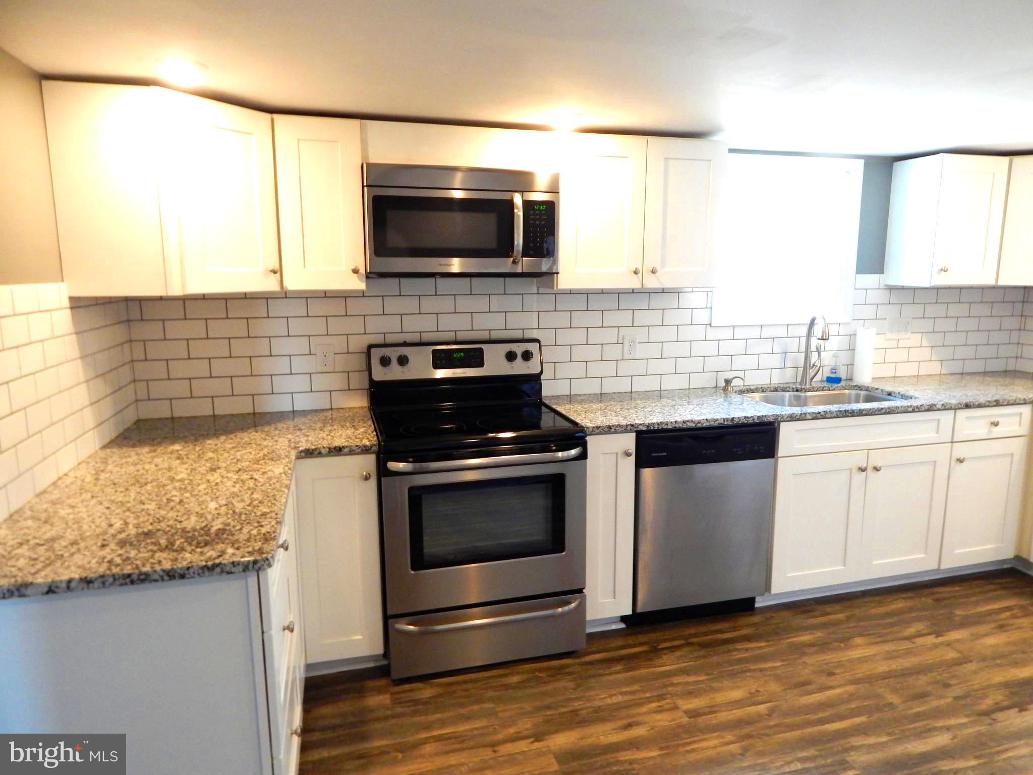 916 Hartly Road Hartly, DE 19953 - Photo 8 of 61 White Cabinets, Stainless Appliances