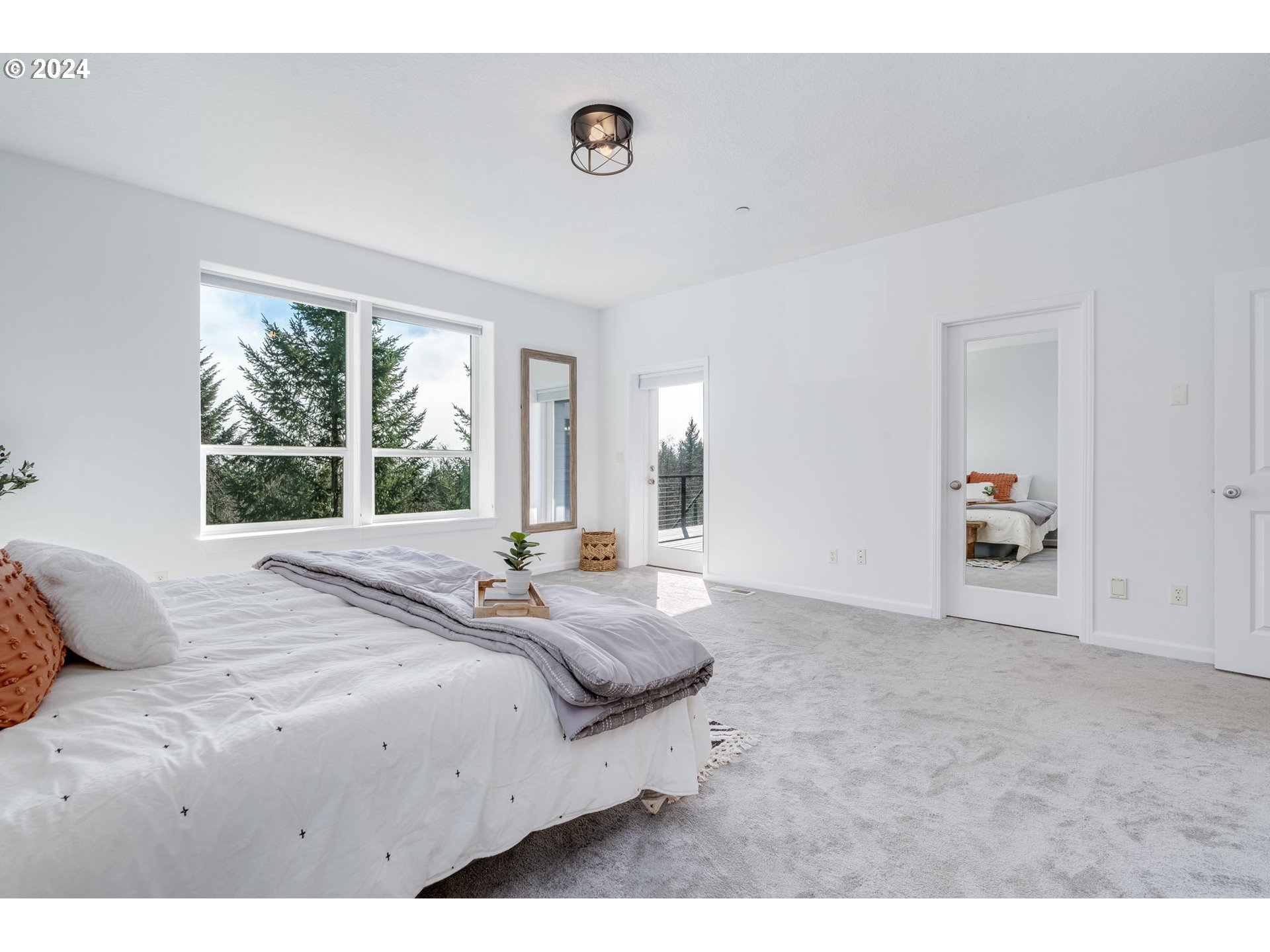 5605 Northeast Lessard Road Camas, WA 98607 - Photo 23 of 47 a bedroom with a bed and a large window