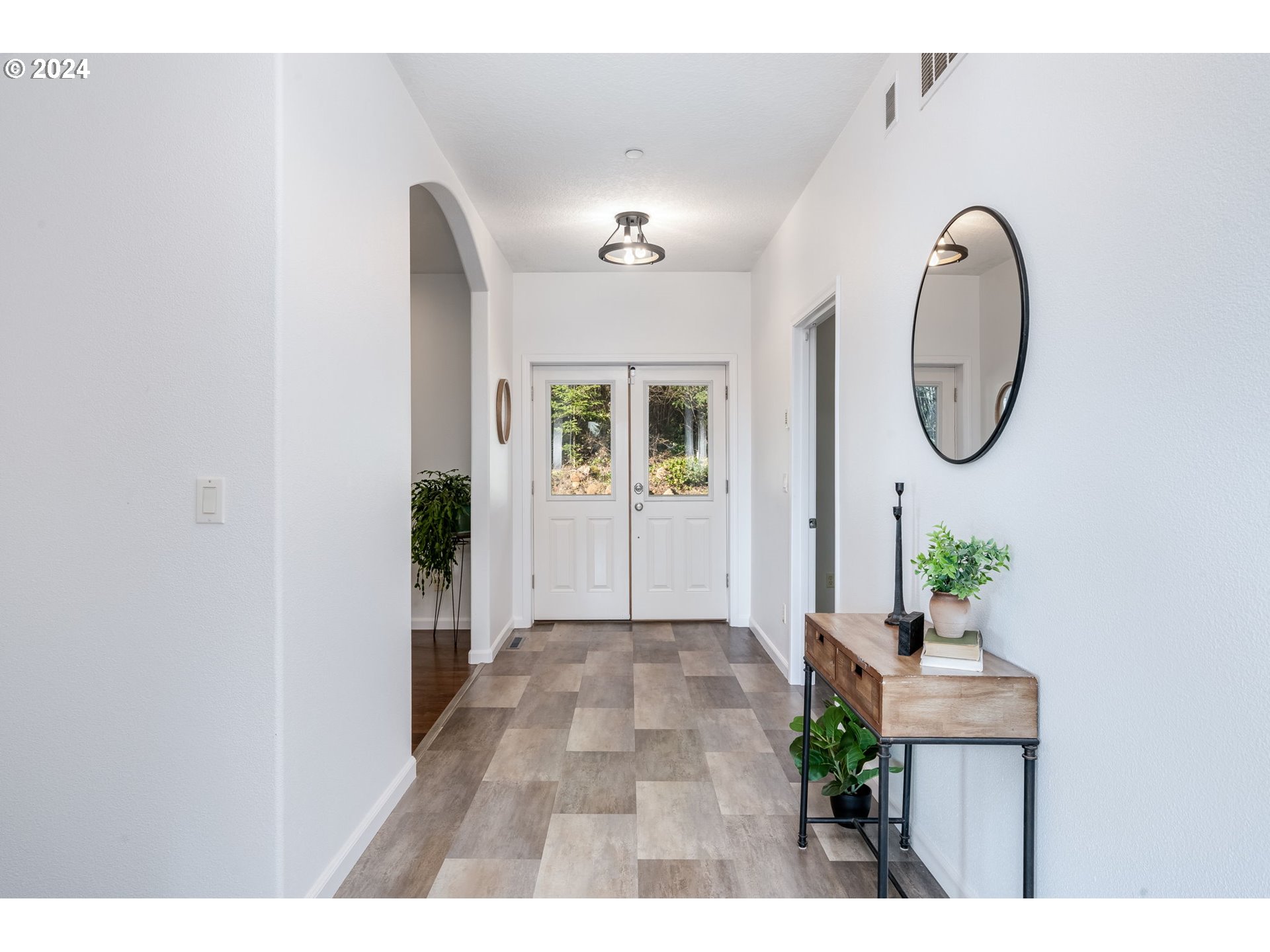 5605 Northeast Lessard Road Camas, WA 98607 - Photo 4 of 47 a view of a hallway with wooden floor