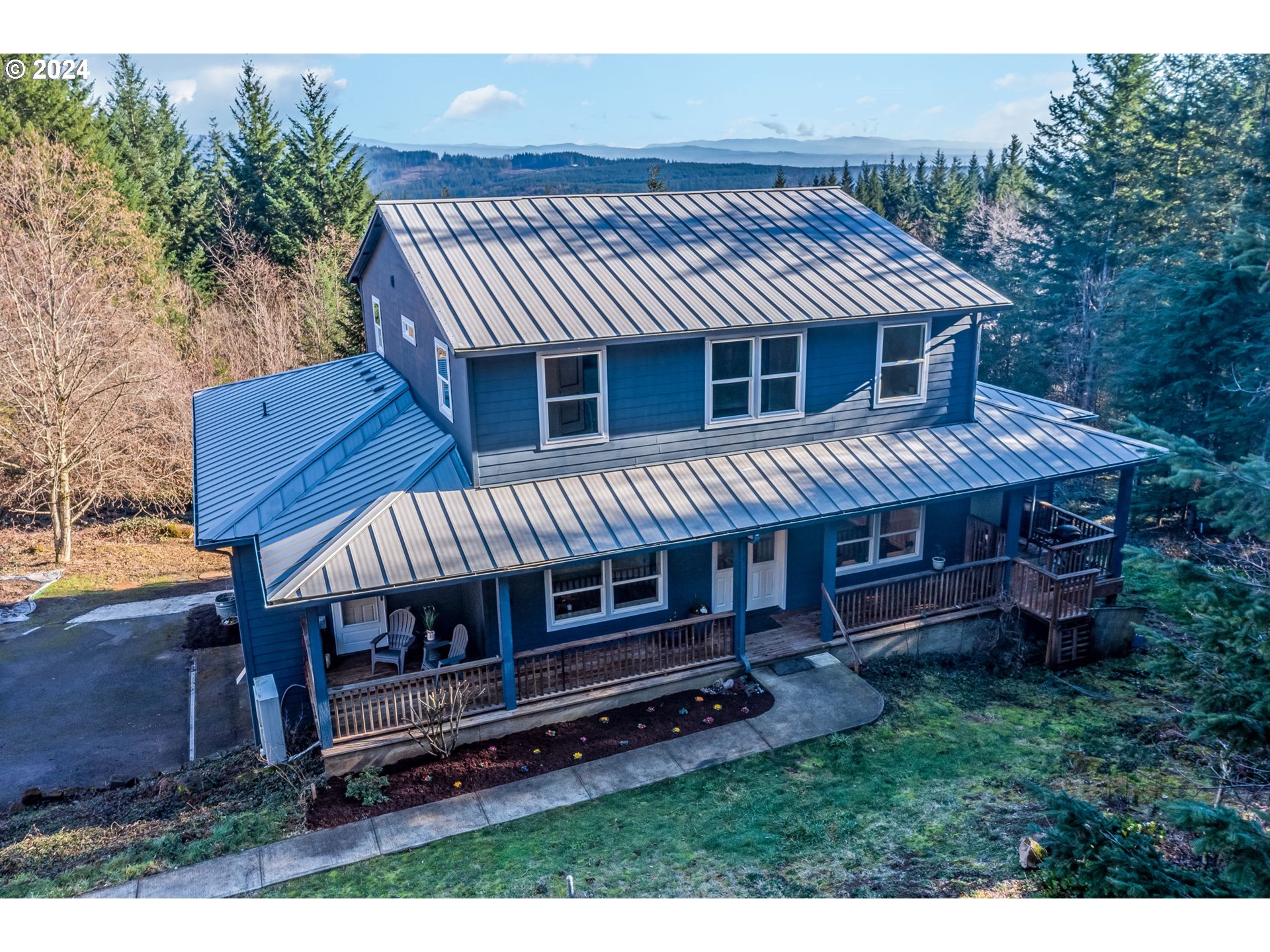 5605 Northeast Lessard Road Camas, WA 98607 - Photo 41 of 47 a front view of a house with a garden and deck