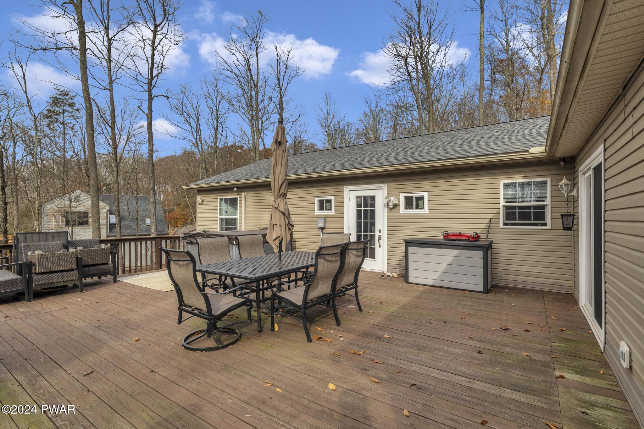 2596 Boulder Road Lake Ariel, PA 18436 - Photo 51 of 57 a view of a dinning table and chairs in patio of the house