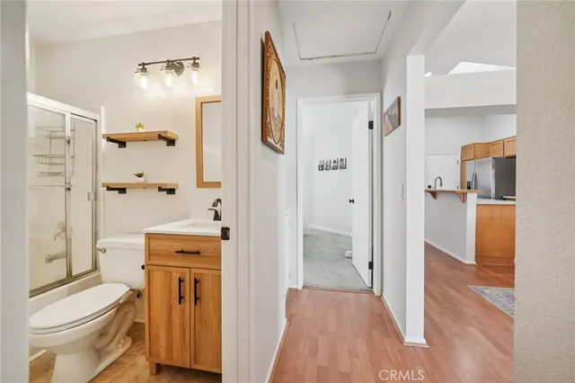 a bathroom with a shower toilet and a sink