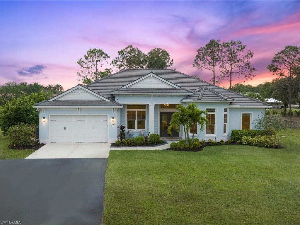 3275 68th Street Southwest Naples, FL 34105 - Photo 1 of 50 Front elevation at twilight