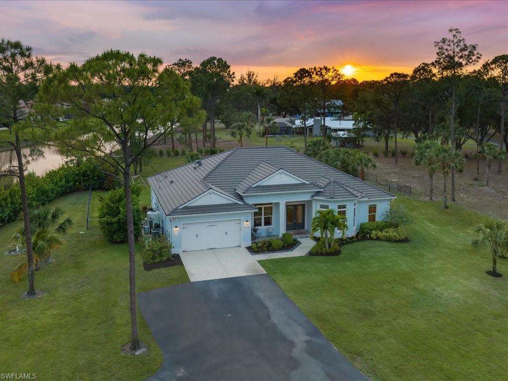 3275 68th Street Southwest Naples, FL 34105 - Photo 3 of 50 Front elevation at twilight