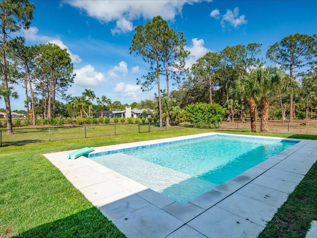 3275 68th Street Southwest Naples, FL 34105 - Photo 33 of 50 pool with child safety fence