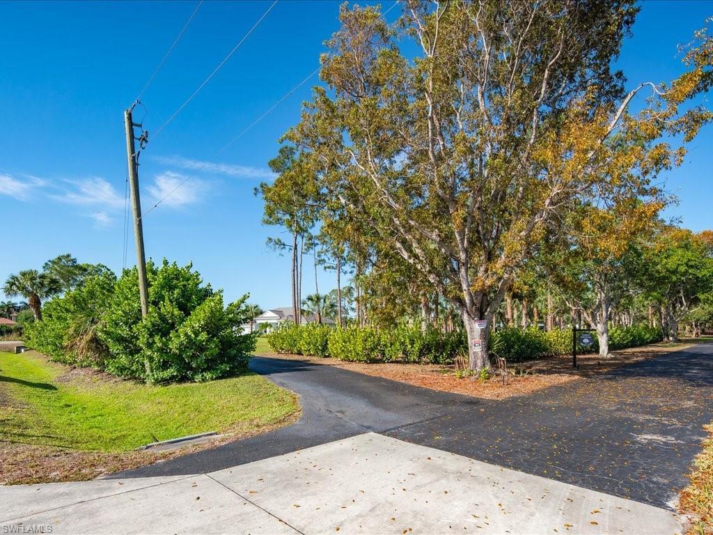 3275 68th Street Southwest Naples, FL 34105 - Photo 42 of 50 entrance to long private driveway