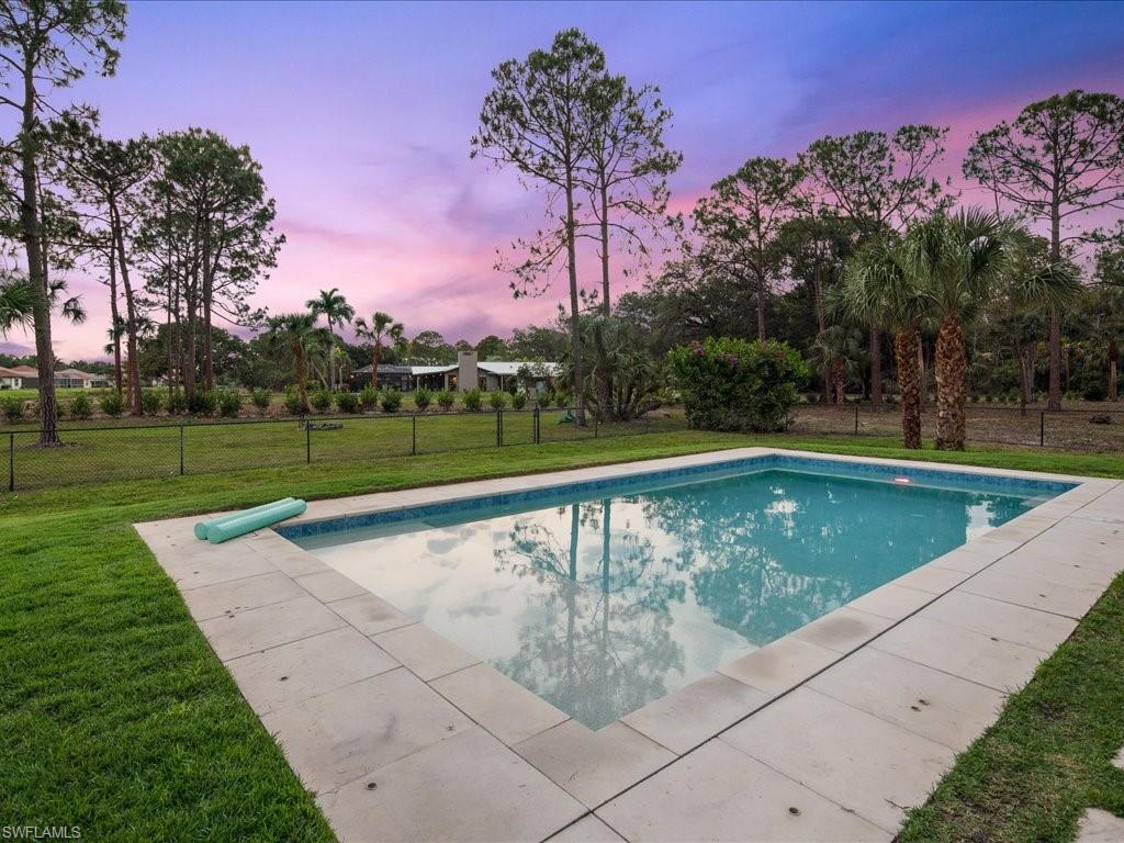 3275 68th Street Southwest Naples, FL 34105 - Photo 43 of 50 pool with shelf and child safety fence