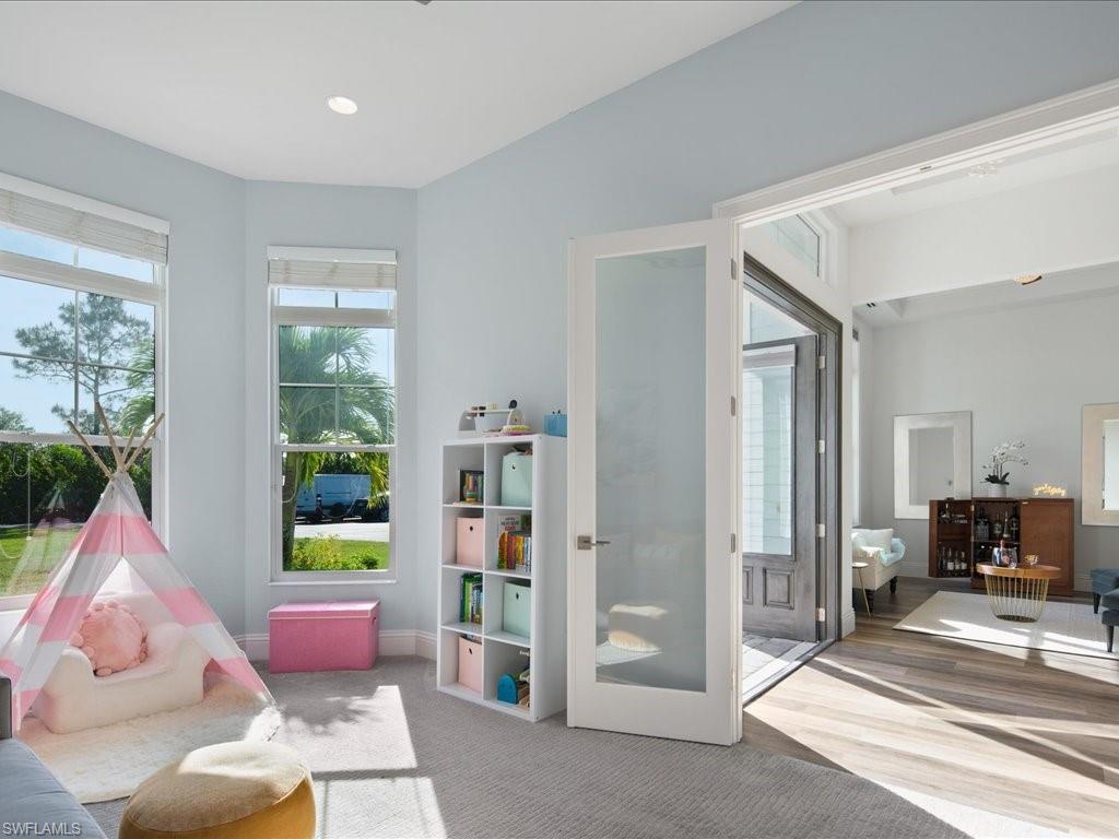 3275 68th Street Southwest Naples, FL 34105 - Photo 6 of 50 looking toward entry and formal dining room