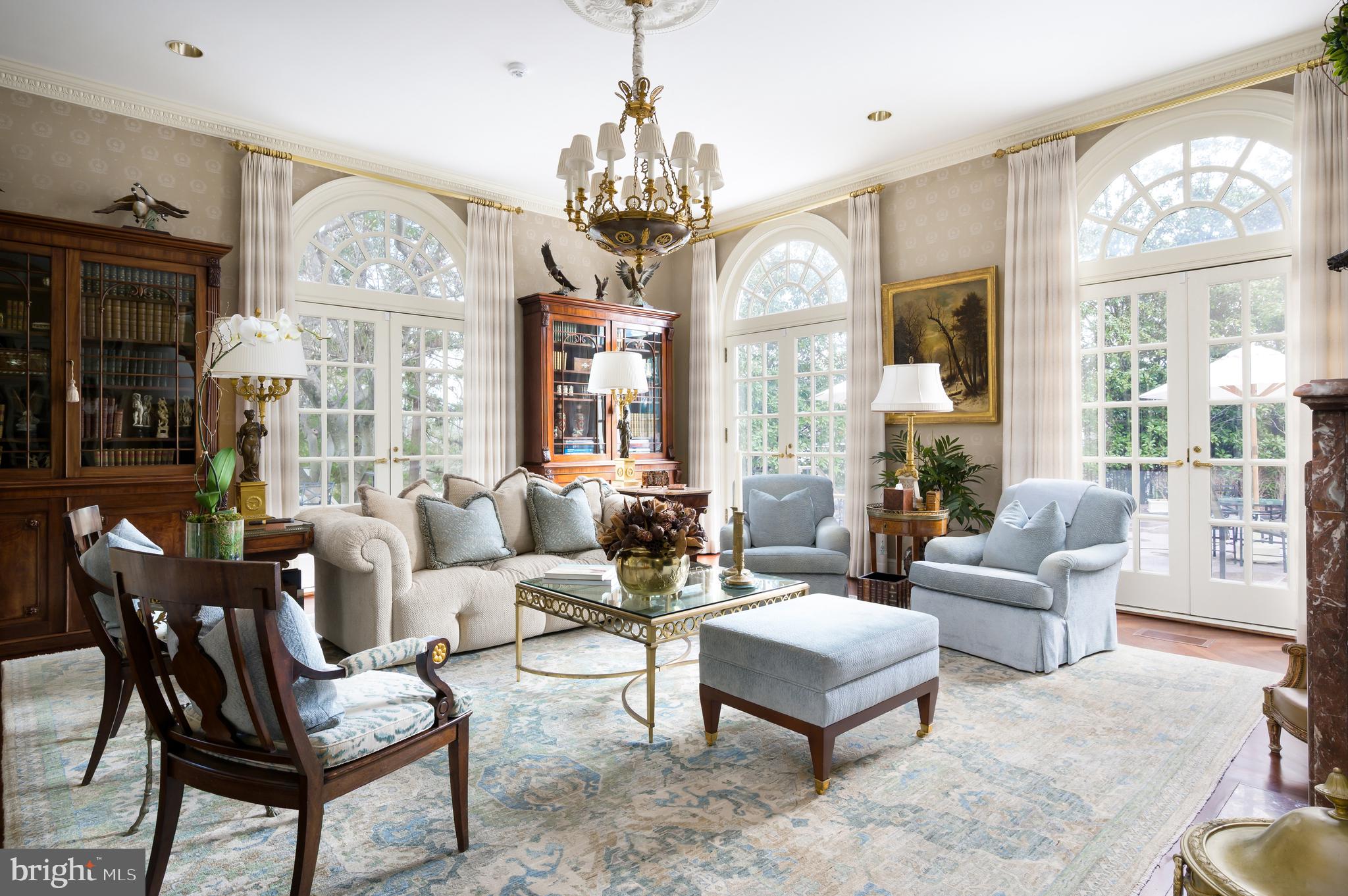 2838 McGill Terrace Northwest Washington, DC 20008 - Photo 15 of 50 a living room with furniture a large window and a chandelier