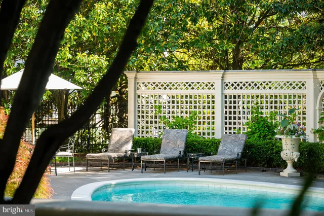 a view of a chair and tables in the garden