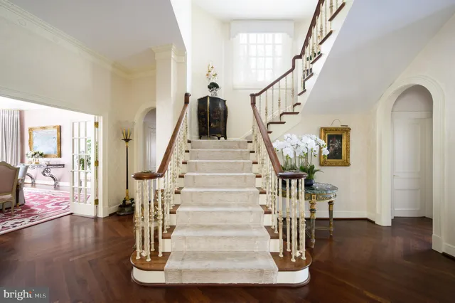 a view of entryway with wooden floor and door