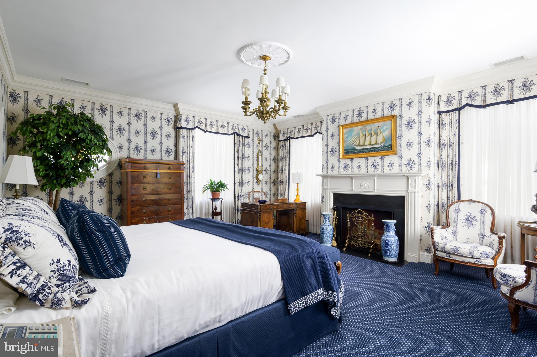 2838 McGill Terrace Northwest Washington, DC 20008 - Photo 40 of 50 a bedroom with bed and a fireplace