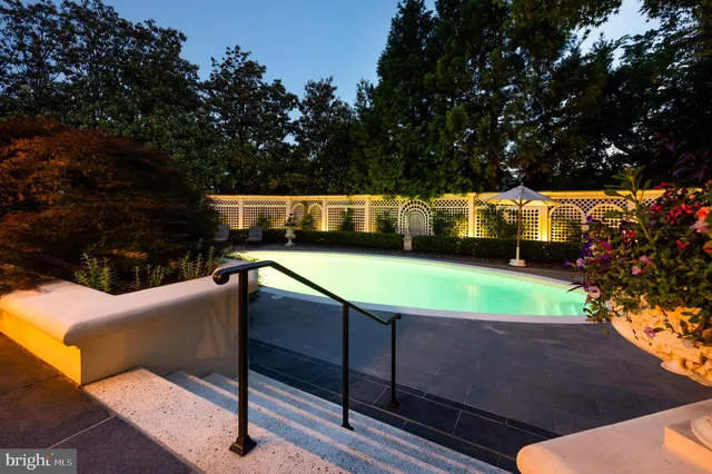a view of swimming pool with seating space