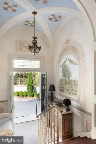 a view of a living room with a floor to ceiling window and a room