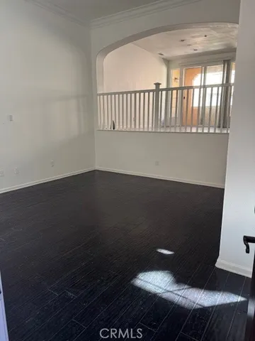 view of wooden floor and windows in an empty room