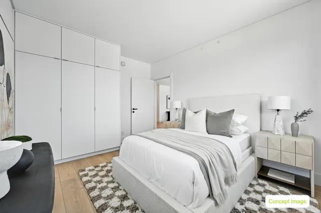 a bedroom with a bed and a couch