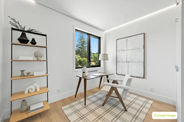 a work room with furniture and a window