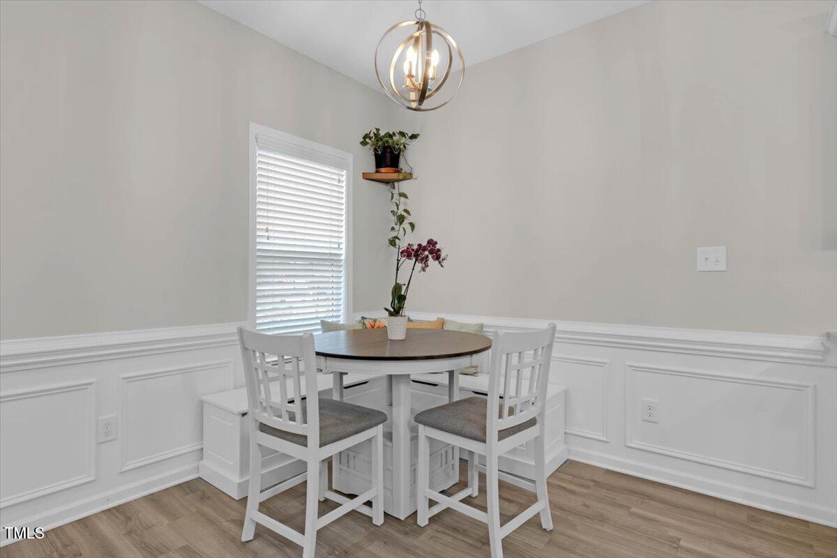 9834 Bitter Melon Drive Angier, NC 27501 - Photo 10 of 29 a view of a dining room that has a table and chairs in it