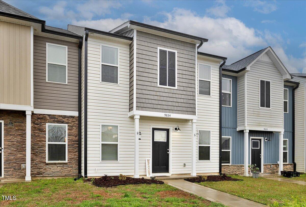 9834 Bitter Melon Drive Angier, NC 27501 - Photo 2 of 29 a front view of a house with a yard