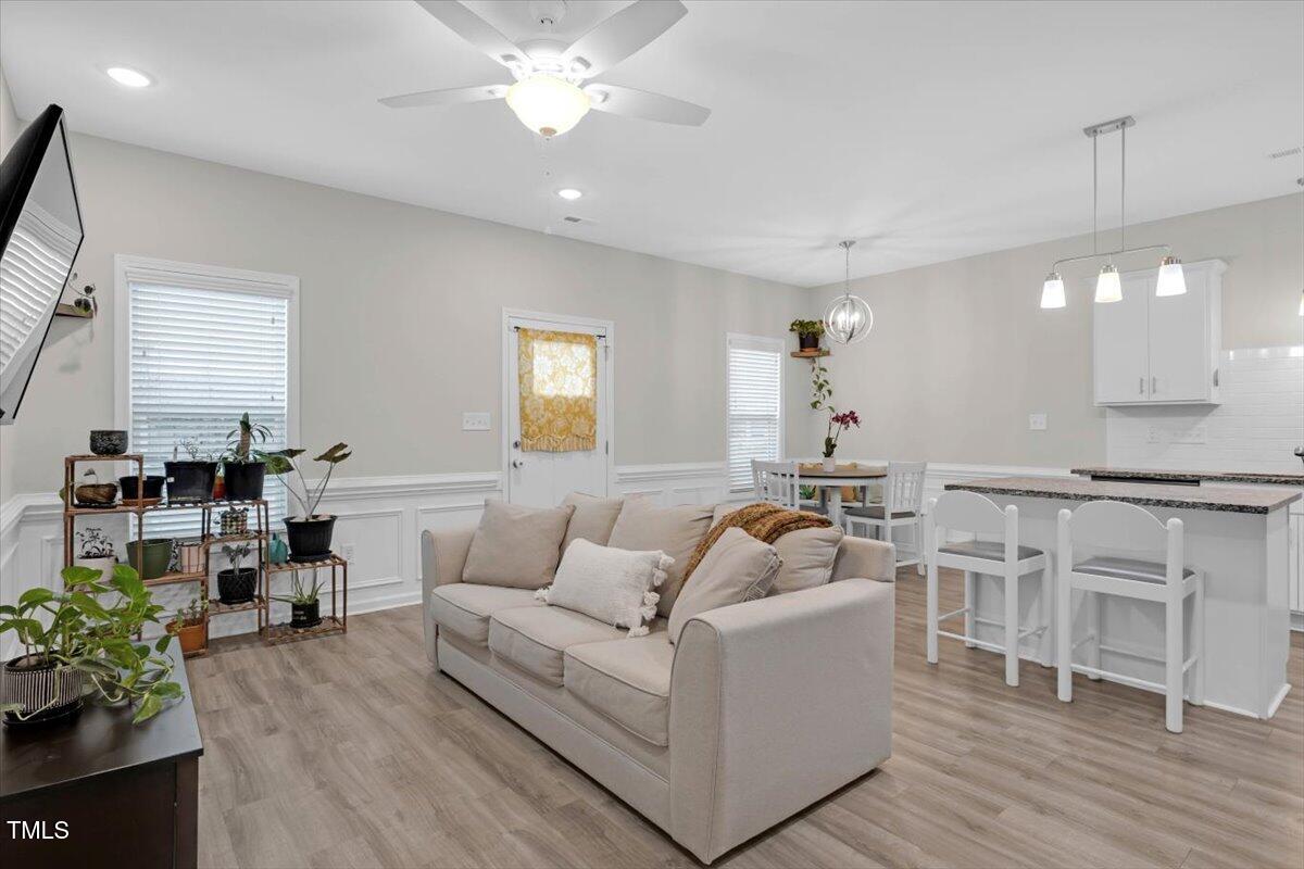 9834 Bitter Melon Drive Angier, NC 27501 - Photo 4 of 29 a living room with furniture and a wooden floor