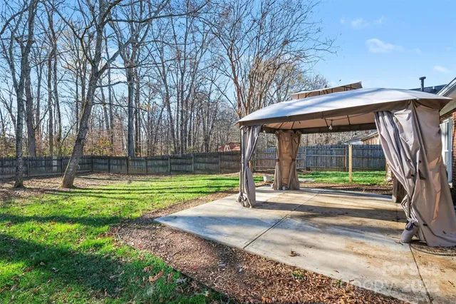 a house view with a sitting space and garden space