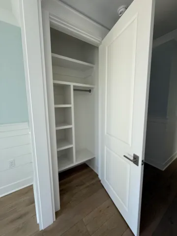 a bathroom with a sink toilet vanity and shower