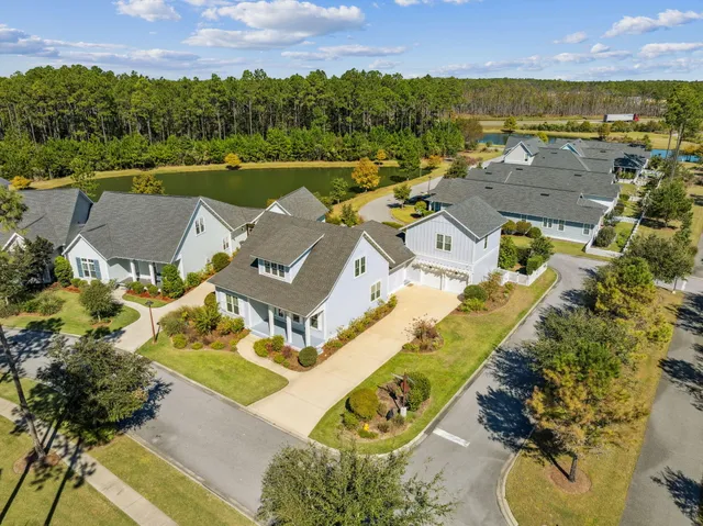 an aerial view of a house with a lake view