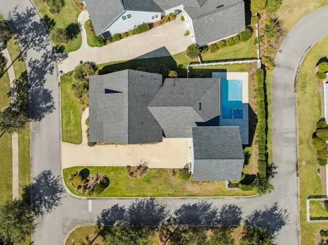 an aerial view of a house with a swimming pool