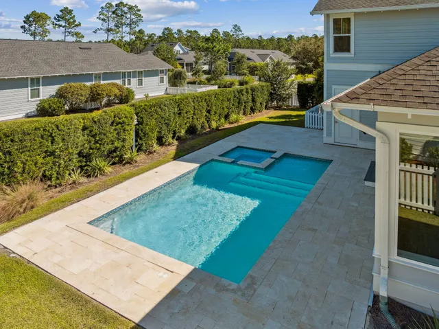 a view of a swimming pool with an outdoor seating
