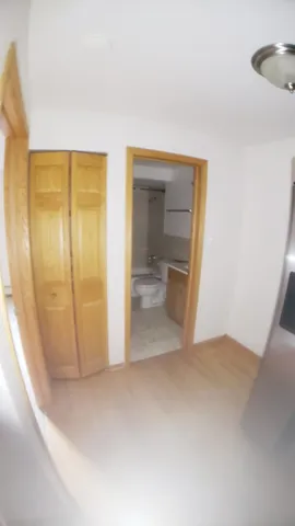 an empty room with a bathroom