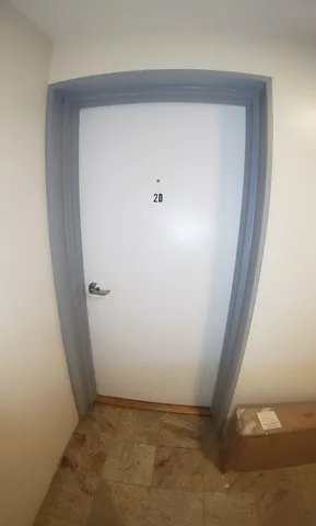 an empty room with wooden floor