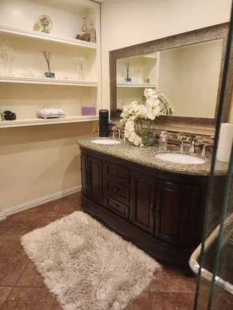 a bathroom with a sink and a mirror