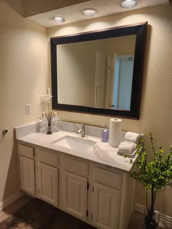 a bathroom with a sink and a mirror