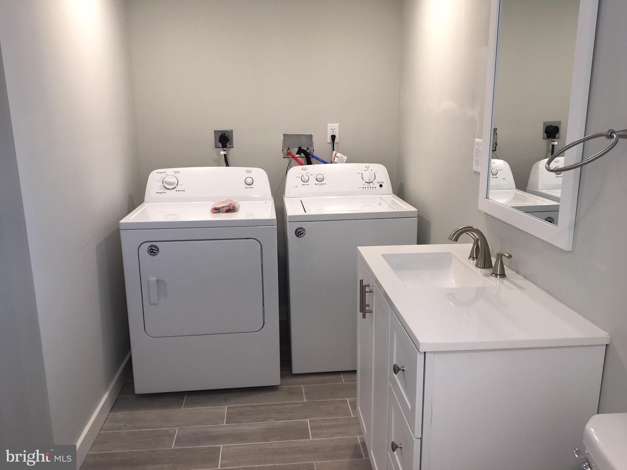 5301 Catharine Street, Unit 3 Philadelphia, PA 19143 - Photo 10 of 12 a utility room with dryer and washer