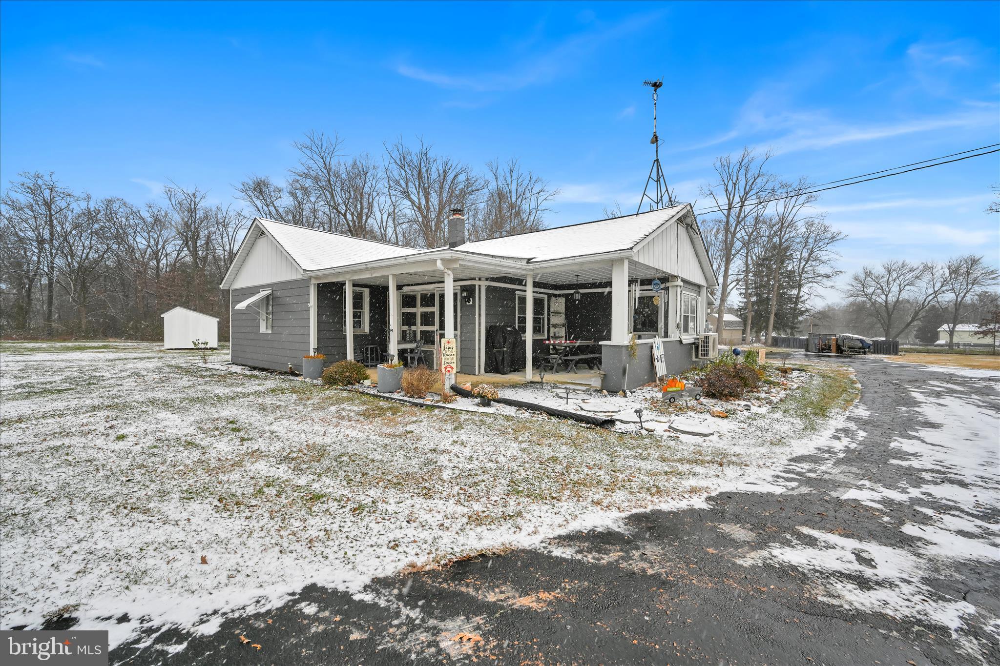 a view of a house with a yard and sitting area