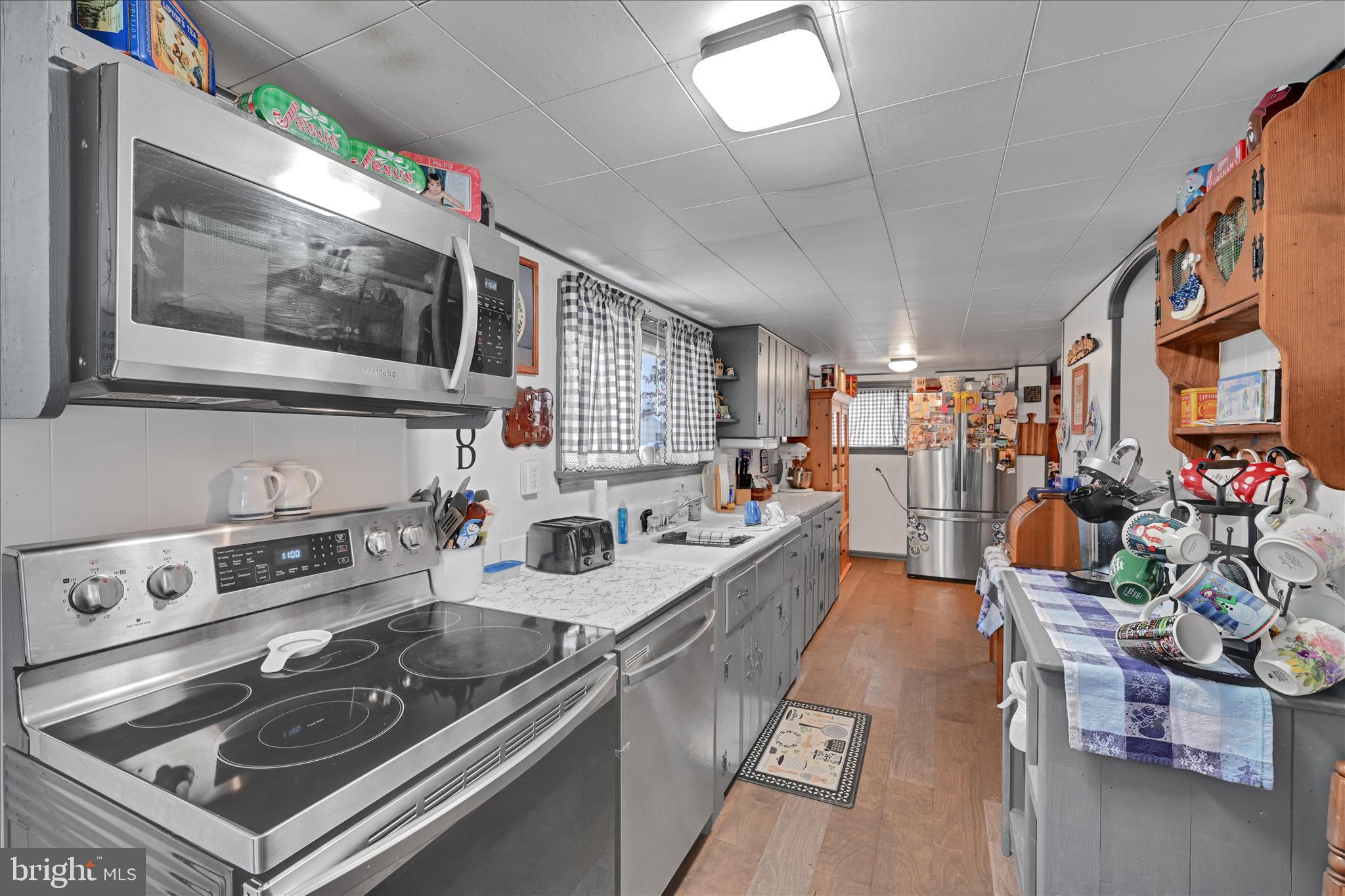 2440 Blue Ball Road Elkton, MD 21921 - Photo 15 of 30 a kitchen with a stove a sink and a microwave