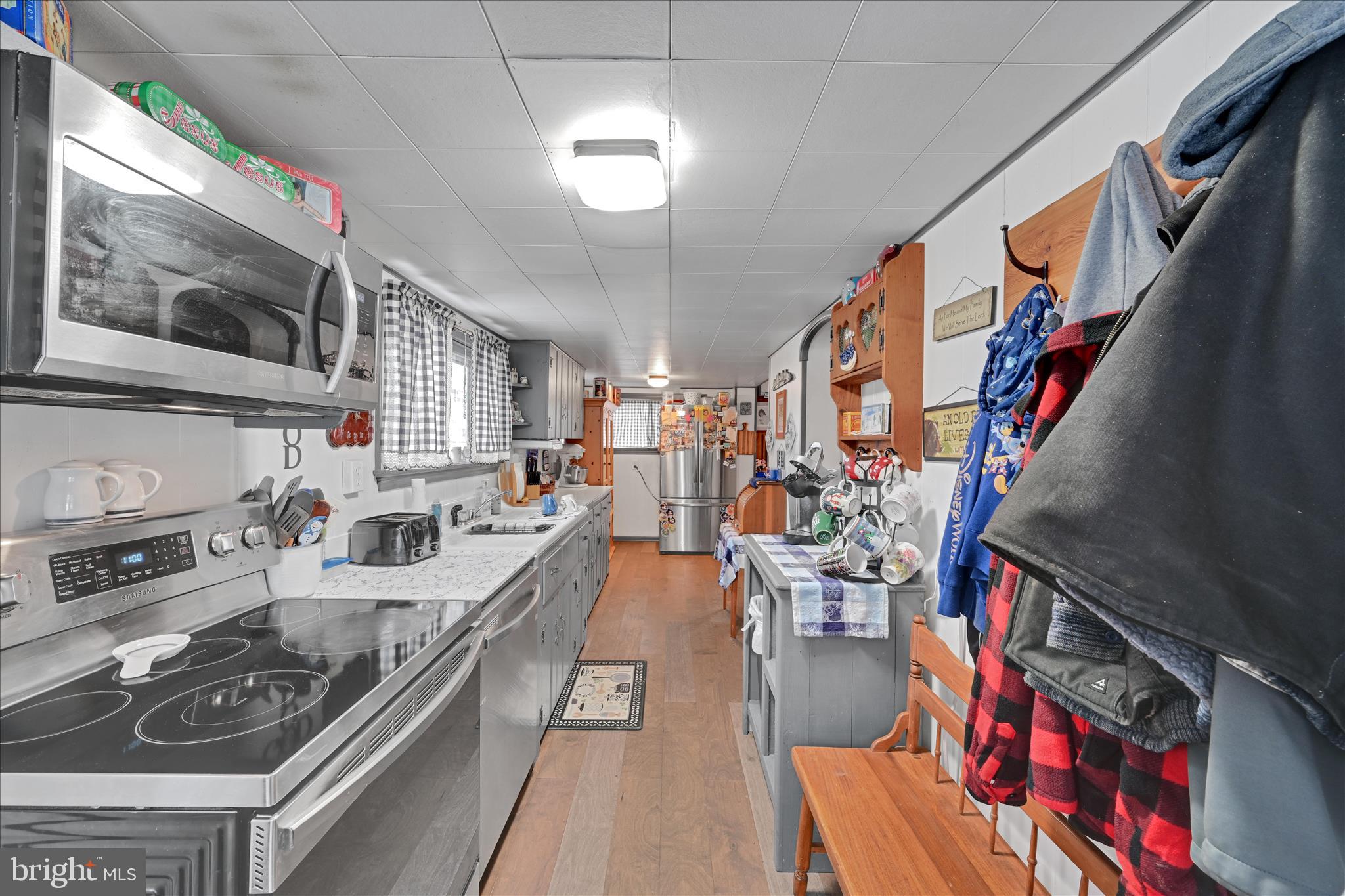 2440 Blue Ball Road Elkton, MD 21921 - Photo 16 of 30 a kitchen with stainless steel appliances granite countertop a stove and a sink