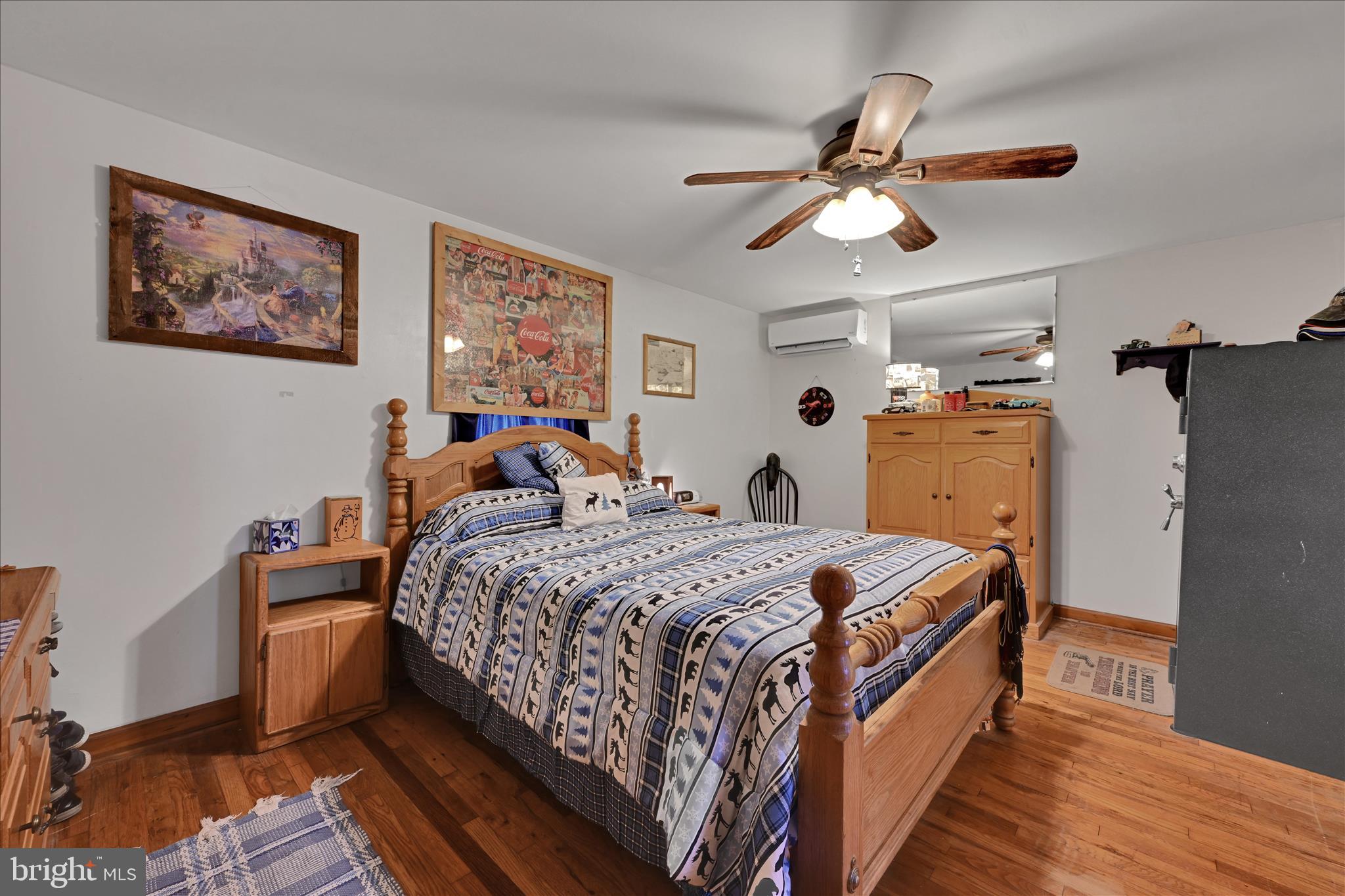 2440 Blue Ball Road Elkton, MD 21921 - Photo 18 of 30 a bed room with a bed and a chandelier