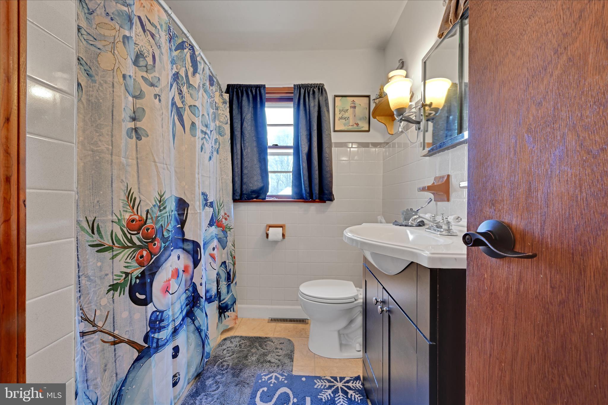 2440 Blue Ball Road Elkton, MD 21921 - Photo 20 of 30 a bathroom with a sink mirror vanity and toilet