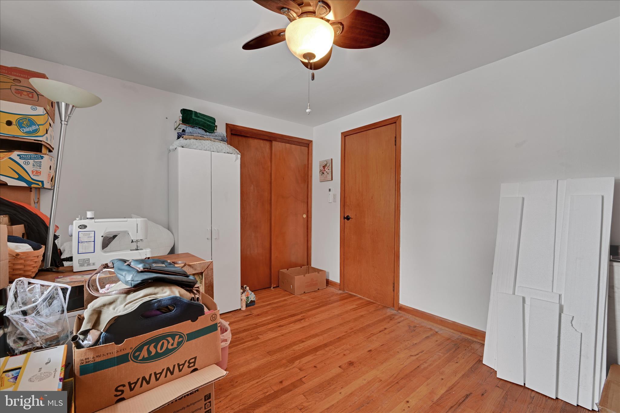 2440 Blue Ball Road Elkton, MD 21921 - Photo 22 of 30 a bedroom with a bed and a chandelier