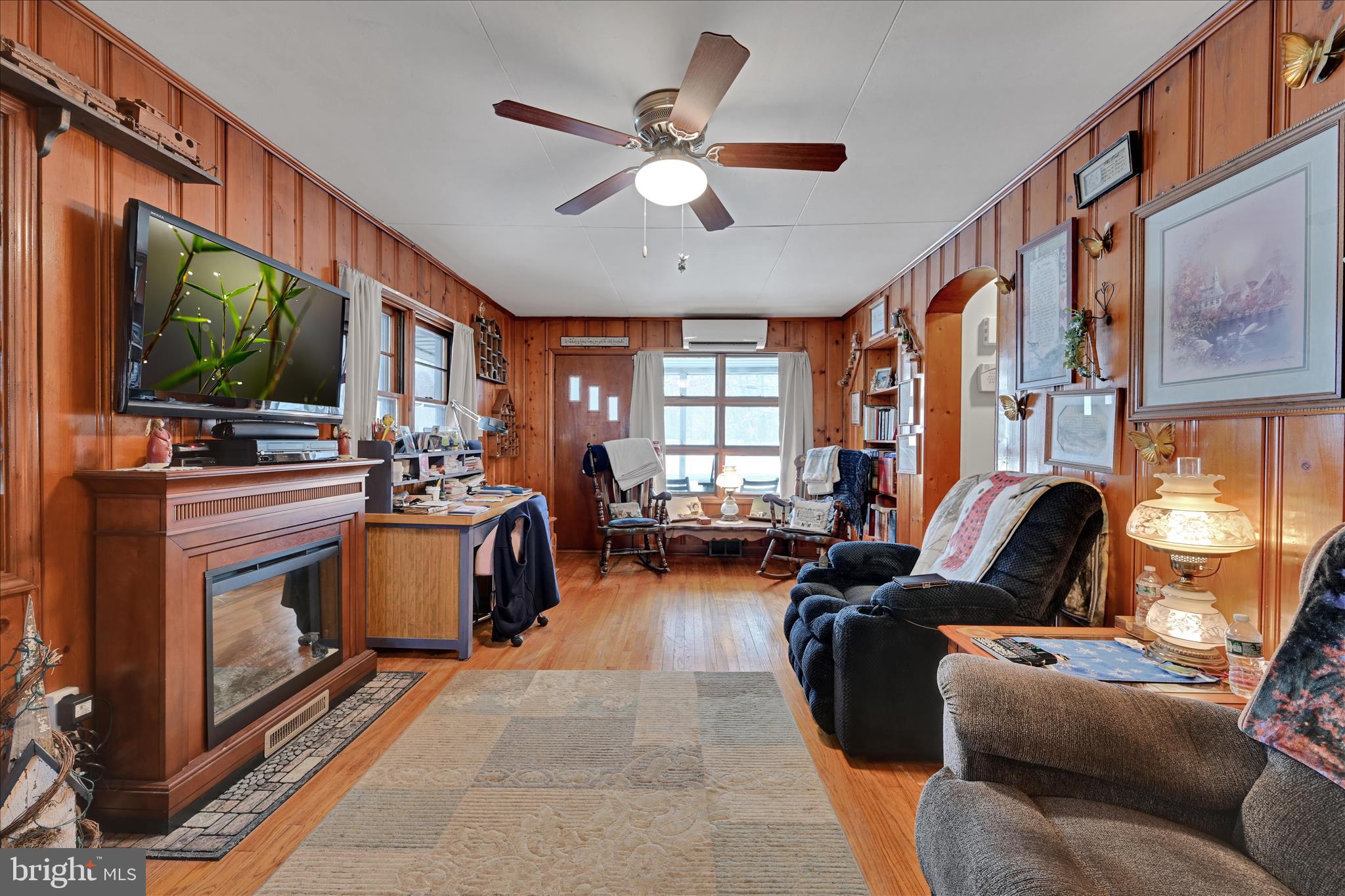 2440 Blue Ball Road Elkton, MD 21921 - Photo 8 of 30 a living room with furniture a flat screen tv and a fireplace