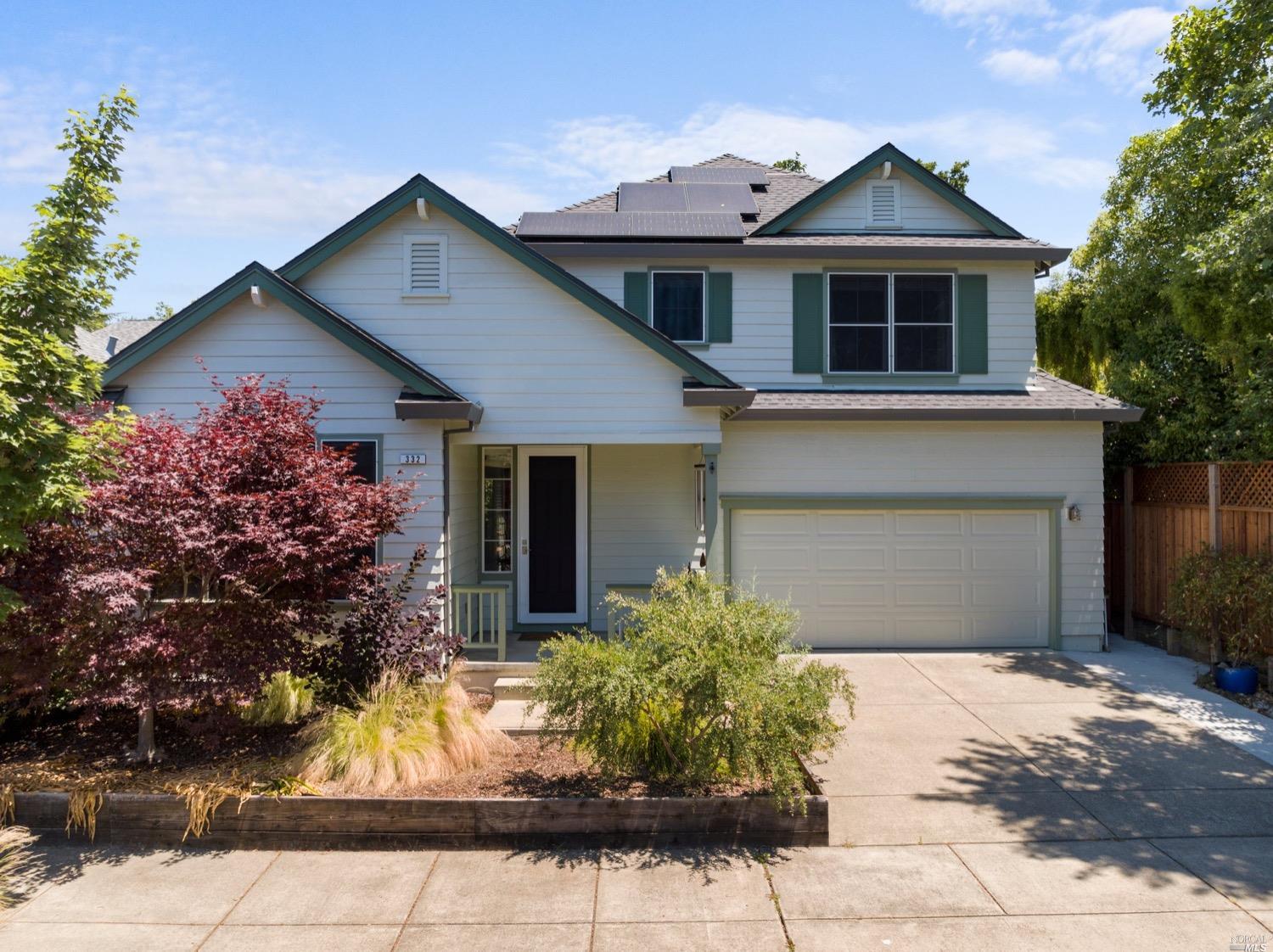 332 Hansbery Way Santa Rosa, CA 95409 - Photo 1 of 1 a front view of a house with a yard and garage