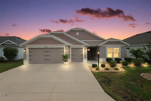 a front view of a house with yard