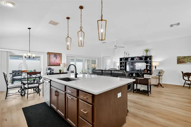 a kitchen with stainless steel appliances granite countertop a stove and a sink