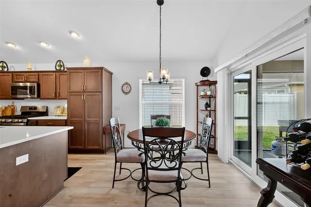 a living room with furniture ceiling fan and a flat screen tv