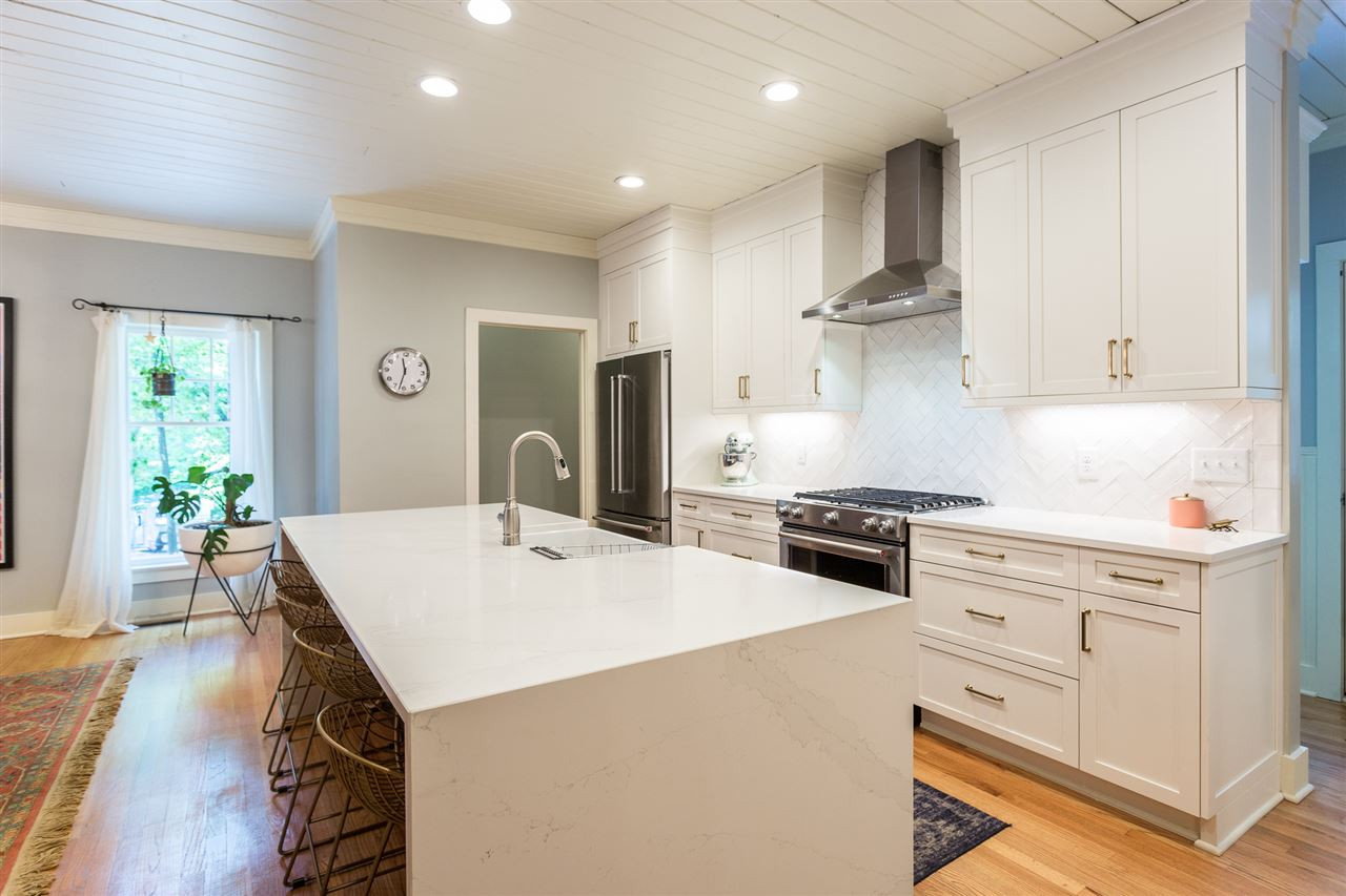 11809 Appaloosa Run East Raleigh, NC 27613 - Photo 14 of 30 This stunning kitchen boasts a beautiful stainless steel range hood which is the perfect compliment to the 5-burner gas range with a convection oven. Subway tiles complete the look of this elegant working kitchen. Kitchen