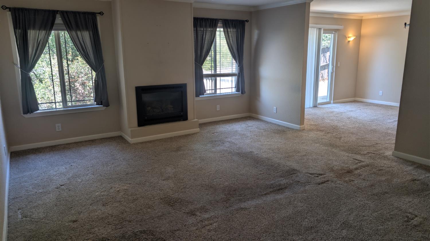 3248 Sudbury Road Cameron Park, CA 95682 - Photo 9 of 41 an empty room with windows and mirror